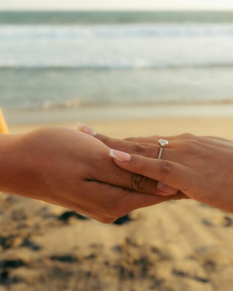 Woman wearing a sparkling engagement ring – buying an engagement ring guide by Nievaa Jewels